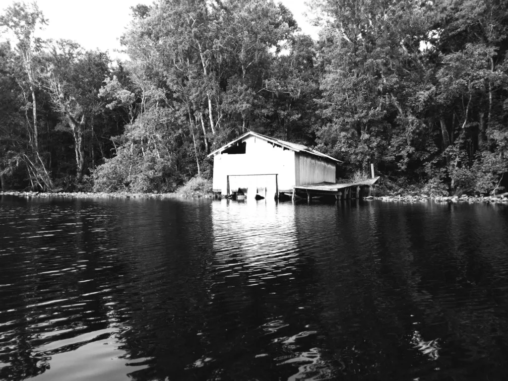 A boathouse on a quiet blackwater creek