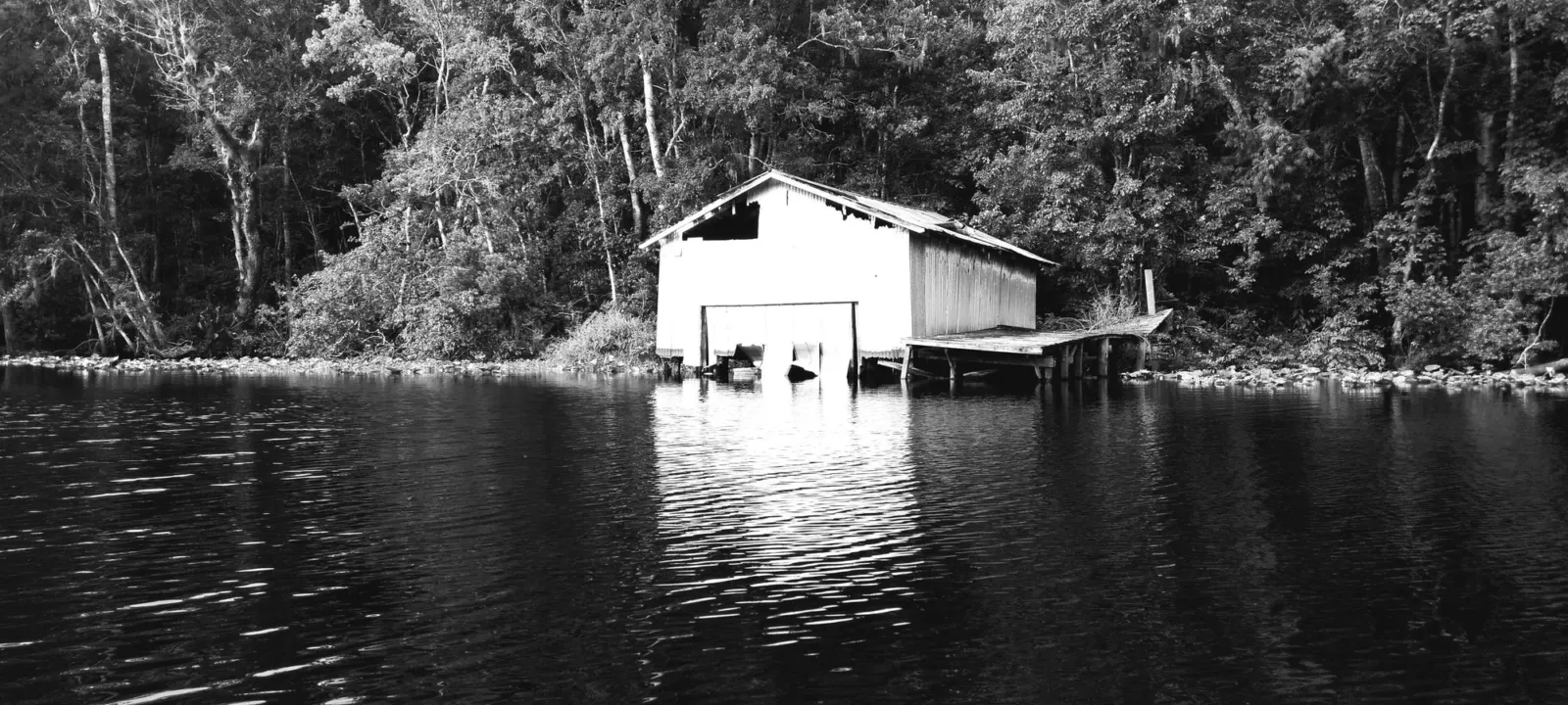 A boathouse on a quiet blackwater creek