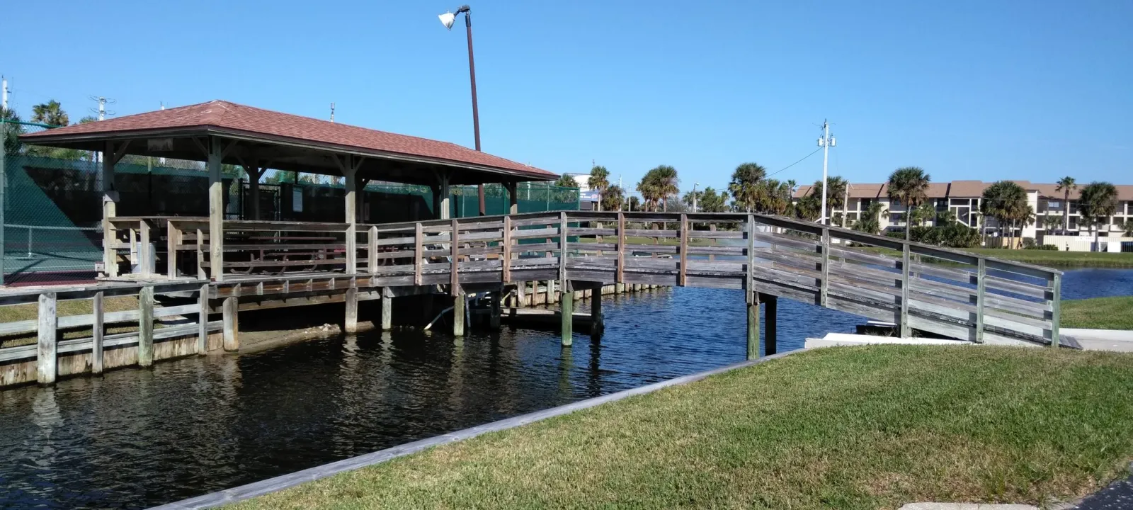 A covered dock on the water