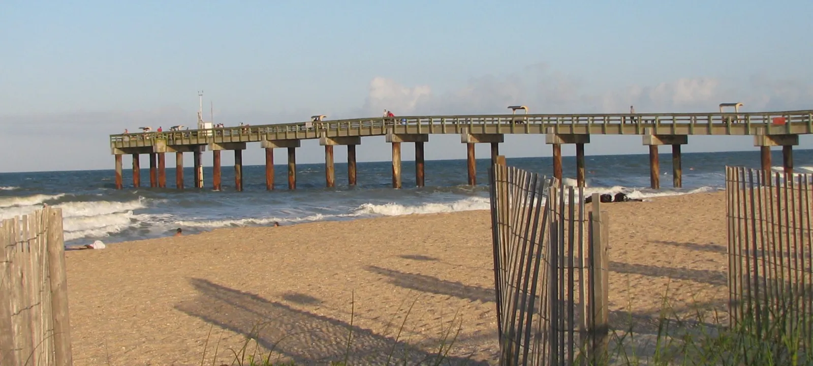 A fishing pier stretching out over the ocean