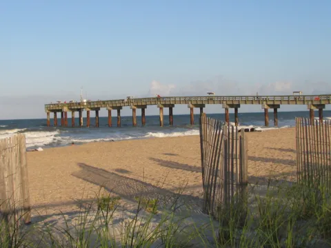A fishing pier stretching out over the ocean