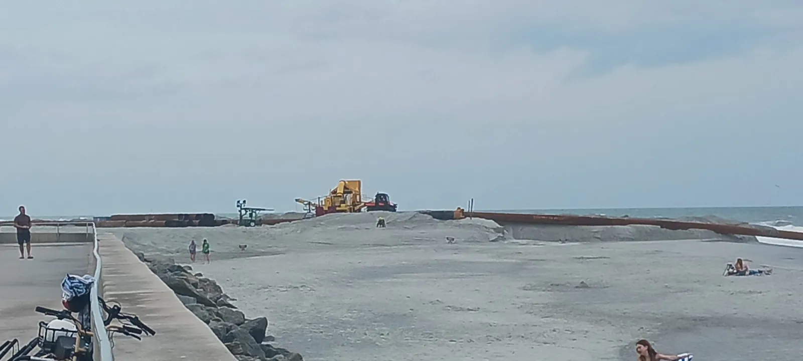 A jetty and pier reaching out from the beach