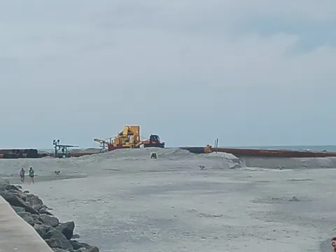 A jetty and pier reaching out from the beach