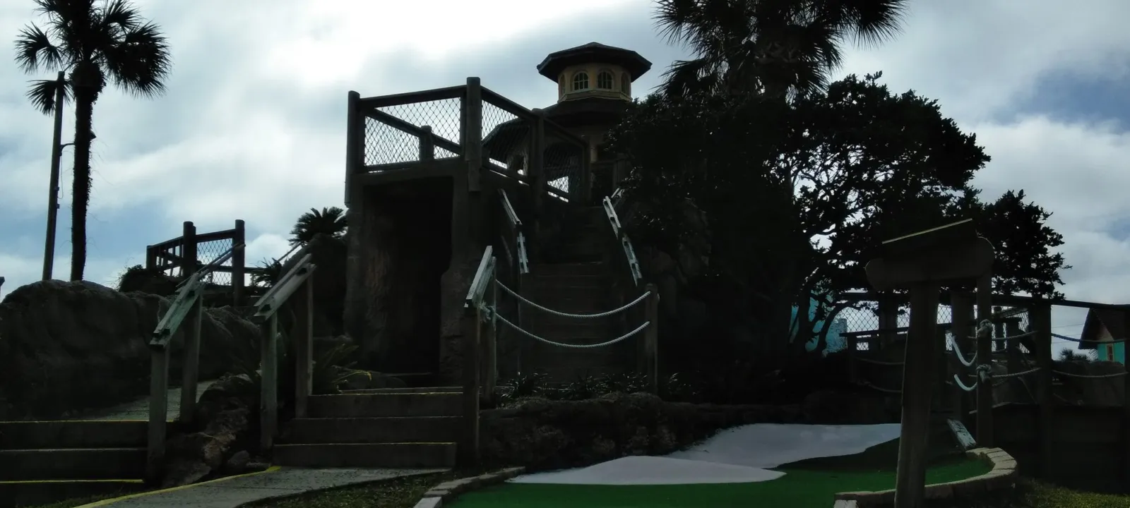 A playground under tall palms