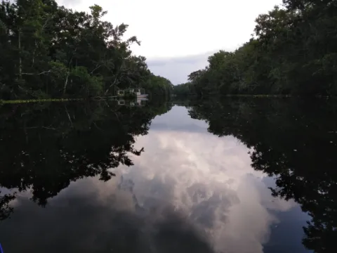 A quiet Florida river reflecting the sky