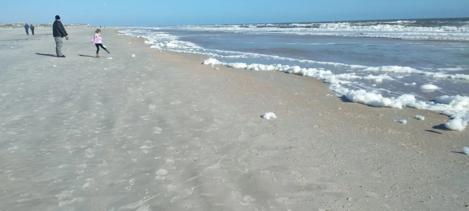 A wide Atlantic beach on a clear morning