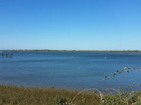 Calm bay water under a clear blue sky