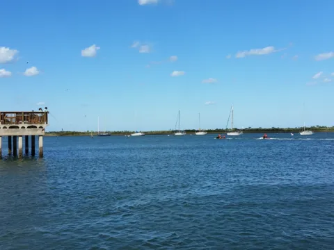 Calm water with docks along the shoreline.