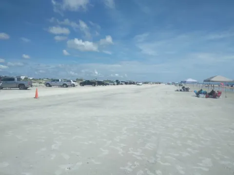 Cars parked on a hard-packed Florida beach