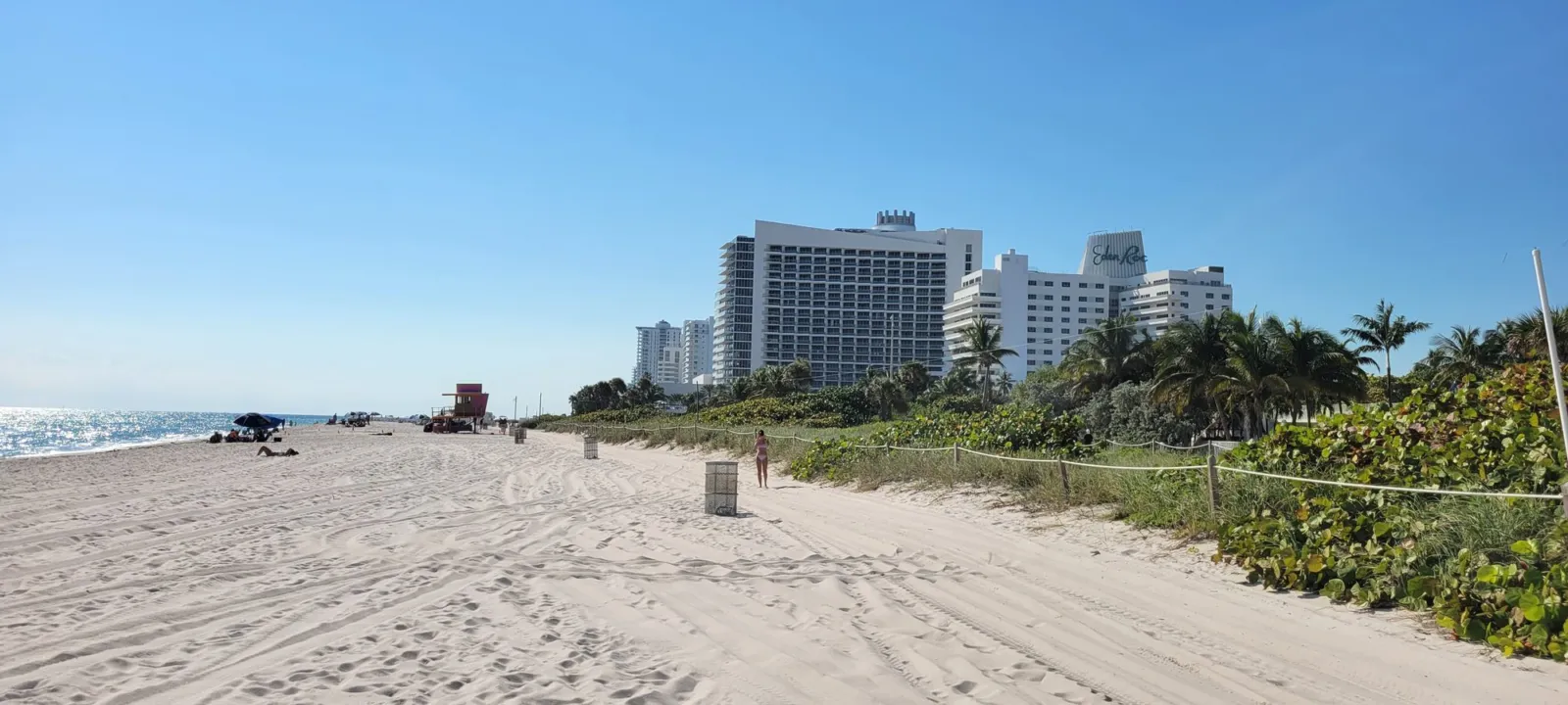 High-rise hotels along a white sand beach