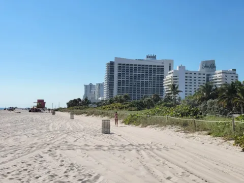 High-rise hotels along a white sand beach