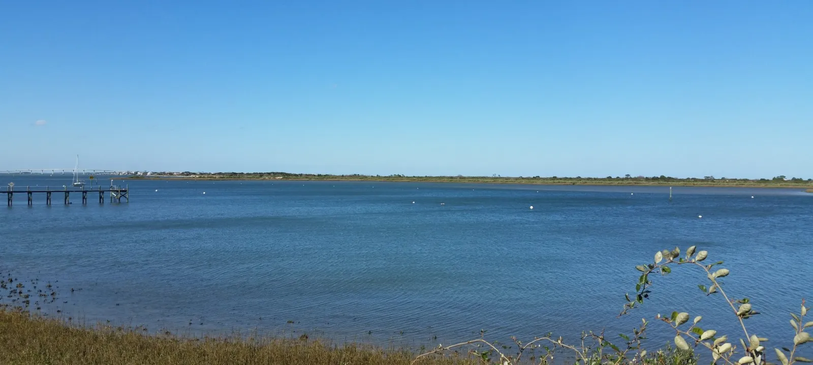 Wide view across calm Intracoastal water on a clear day