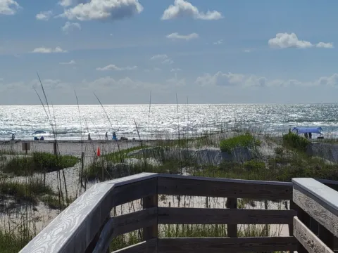 Wooden boardwalk overlook above the dunes and the Atlantic